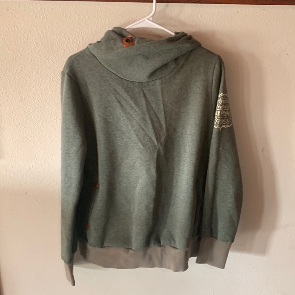 Green hoodie with a Bible verse